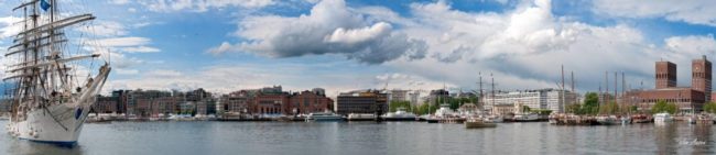 Panorama of Christian Radich ahead of Aker Brygge with Oslo town hall at right